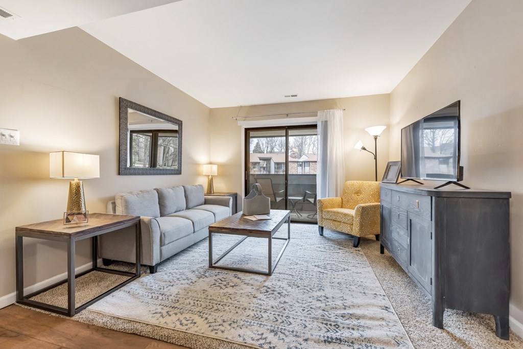 Living Room With TV at Whisper Hollow Apartments, Missouri, 63043