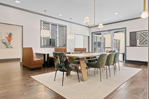 A dining room with a table surrounded by chairs at Aster Apartments, Beachwood, OH