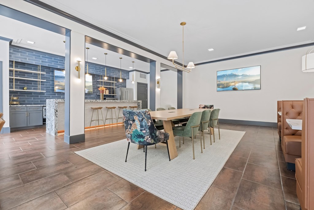 A modern dining room with a wooden table and chairs at Aster Apartments, Beachwood Ohio