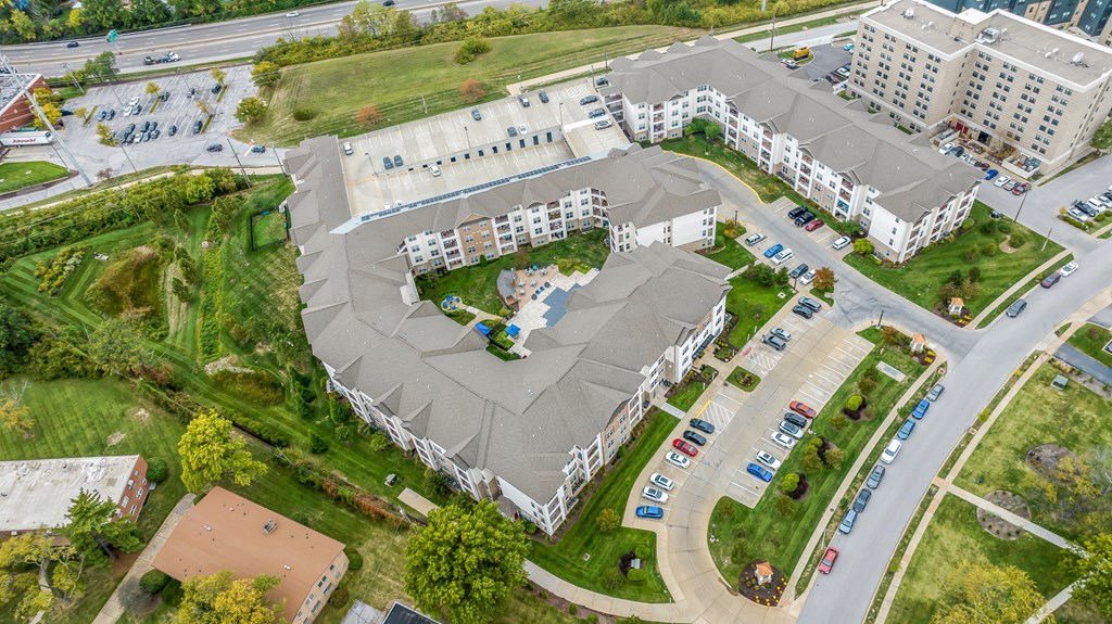 an aerial view of an apartment complex with a parking lot at Vanguard Crossing, St. Louis, MO