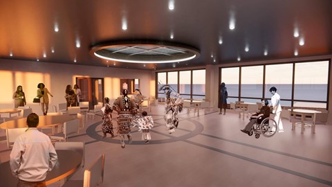 A group of people are gathered in a modern, open space with a view of the ocean.