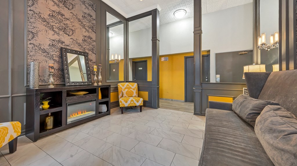 a living room with a couch and a fireplace