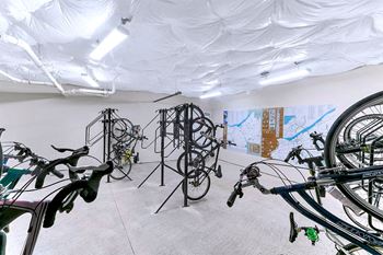 a room filled with bikes and paintings on the wall  at Aster Apartments, Beachwood, OH 44122