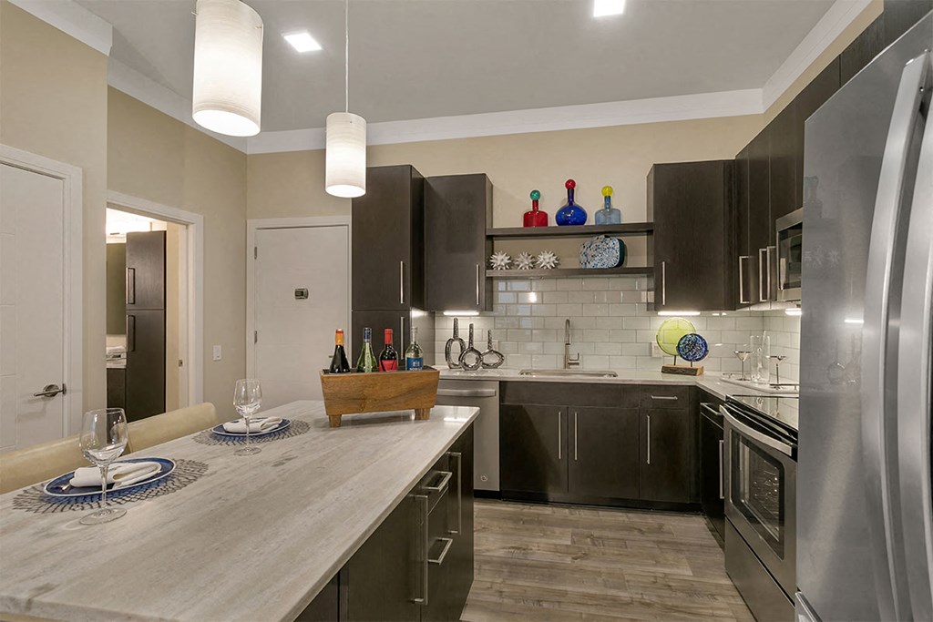 a kitchen with stainless steel appliances and a counter top at Aster Apartments, Ohio