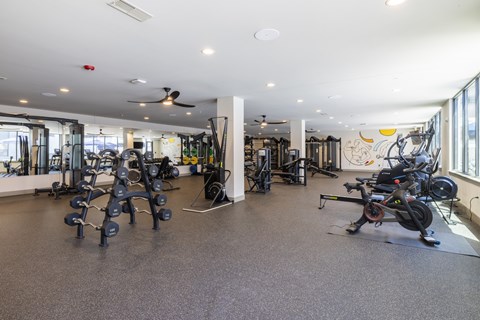 Spacious fitness center with cardio and weight equipment at Timber Club Apartments, St. Peters