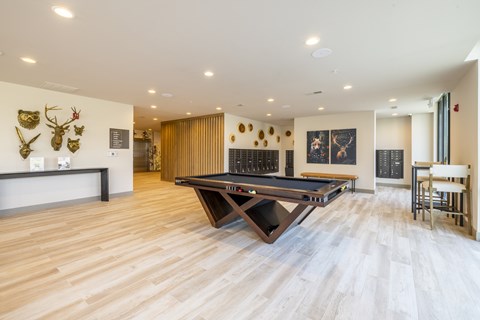 Recreation room with pool table and wood flooring at Timber Club Apartments, Missouri, 63304