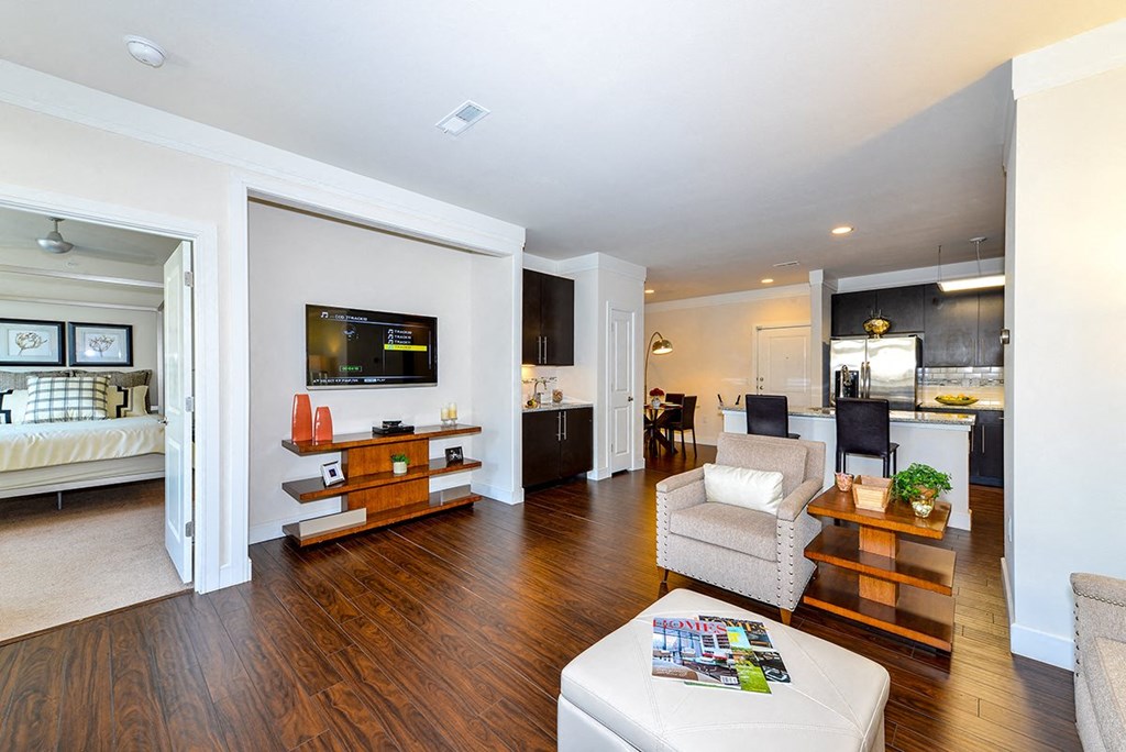 Living Room With Kitchen View at Vanguard Crossing, St. Louis, MO