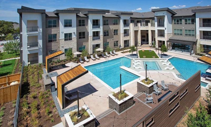 an aerial view of an apartment building with a swimming pool at Hunters Creek Apartments, Denton, 76210