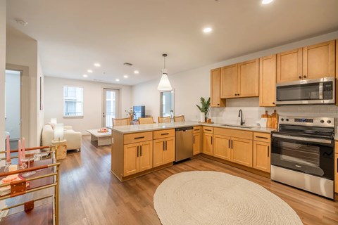 A kitchen with wooden cabinets and stainless steel appliances.