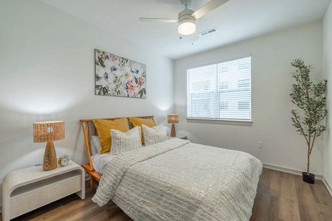 Bedroom with natural light and wood flooring at Timber Club Apartments, St. Peters, 63304