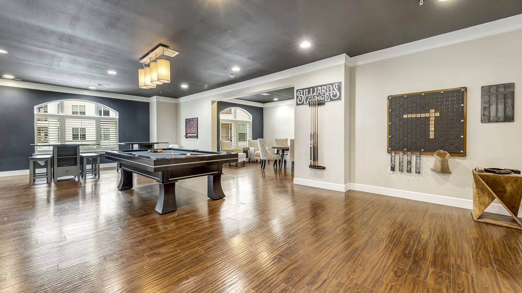a game room with a pool table and a bar at Vanguard Crossing, St. Louis