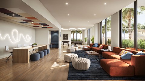 A modern living room with a large orange sofa and a wooden floor.