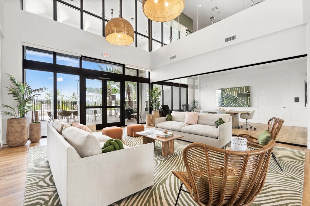 a living room filled with furniture and a large window