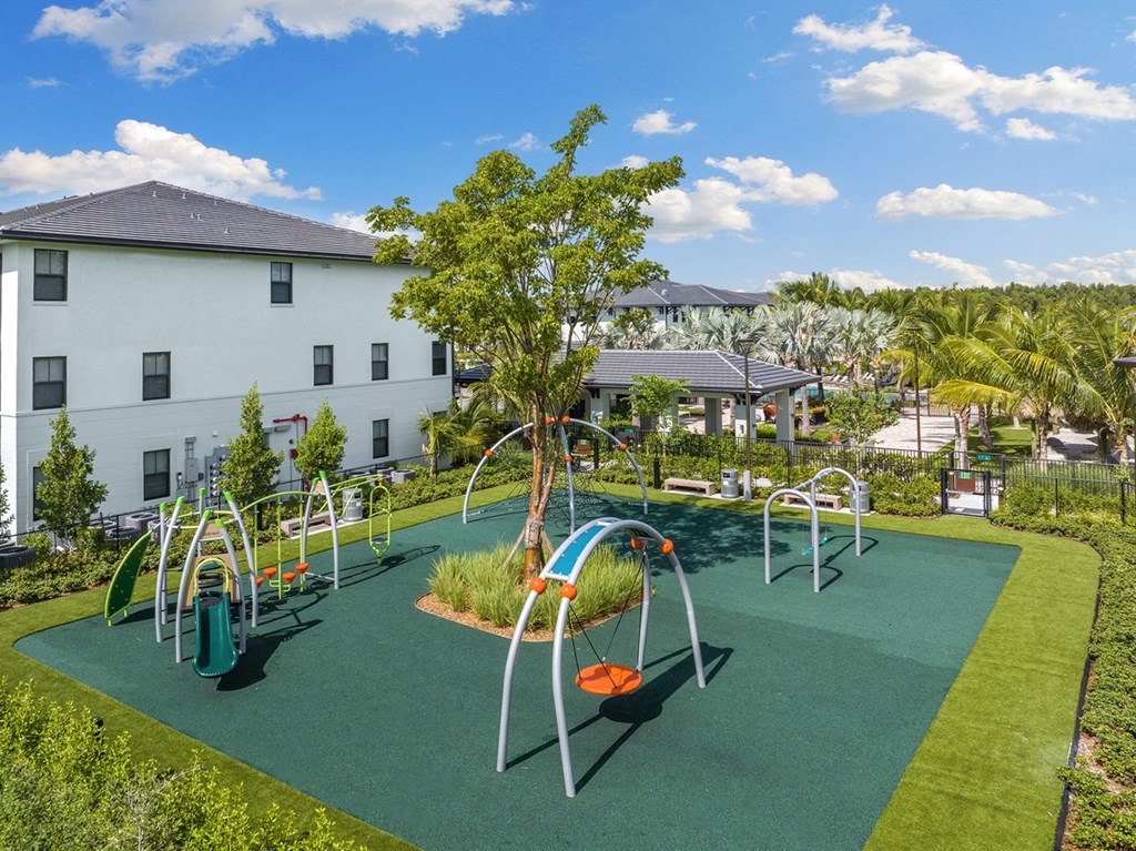a playground at the enclave at woodbridge apartments in sugar land, tx