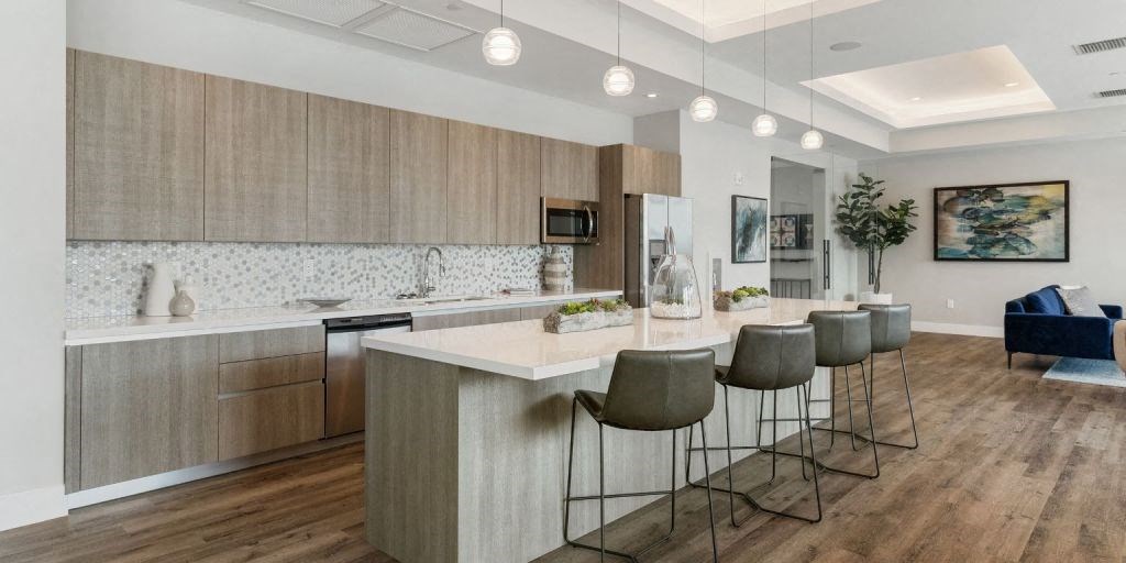 a kitchen with an island and stools