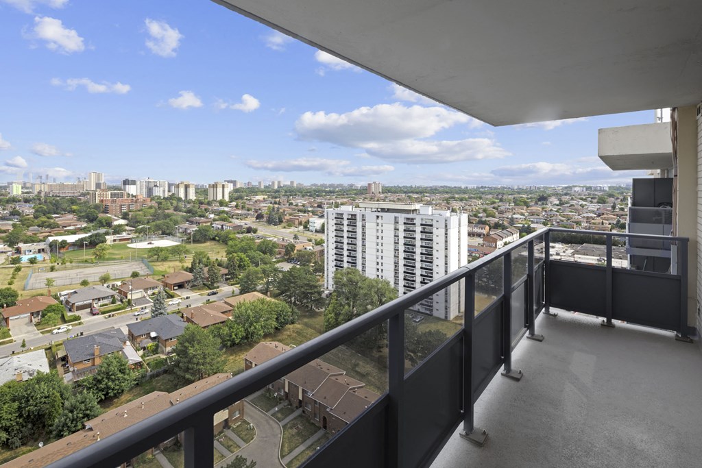 a view of the city from a balcony of a building