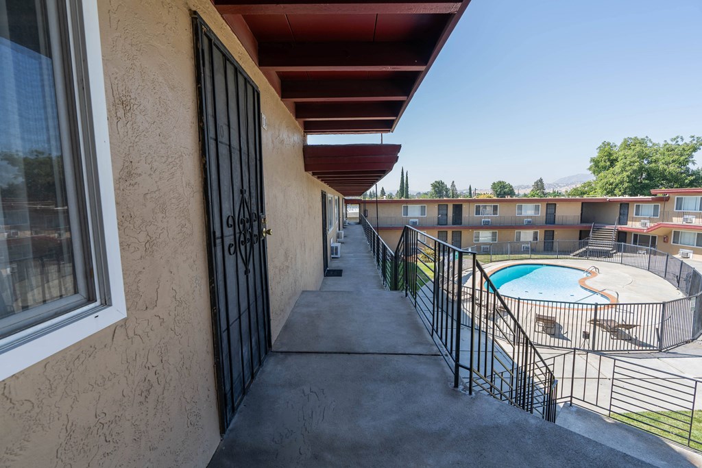 a view of the balconies at the whispering winds apartments in pearland, tx