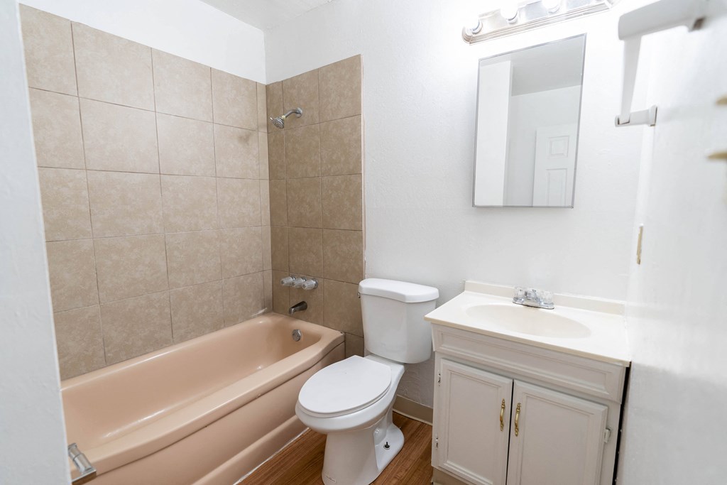 a bathroom with a toilet sink and bathtub