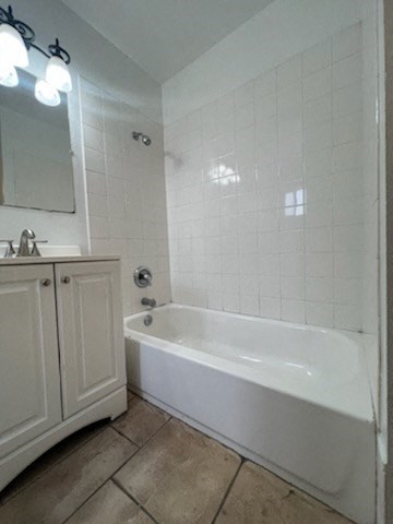 a bathroom with a bathtub and a sink