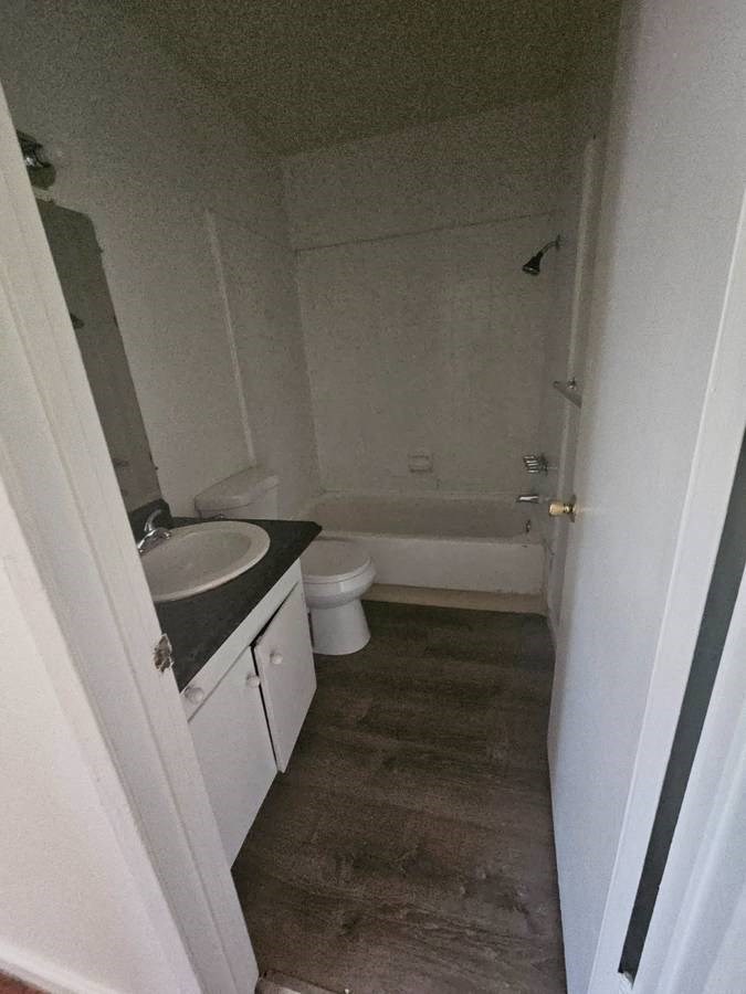 a bathroom with a sink toilet and bathtub