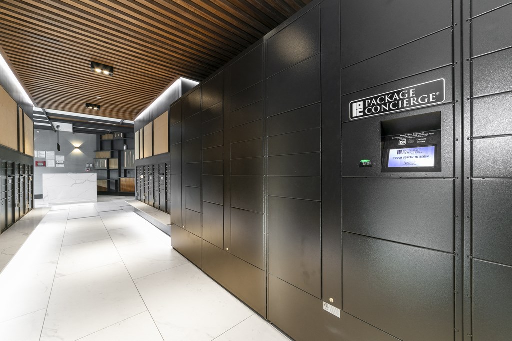 A long hallway with a sign that says Package Concierge.