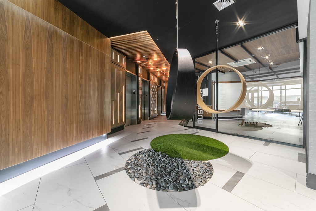 A modern interior with a green circle on the floor.
