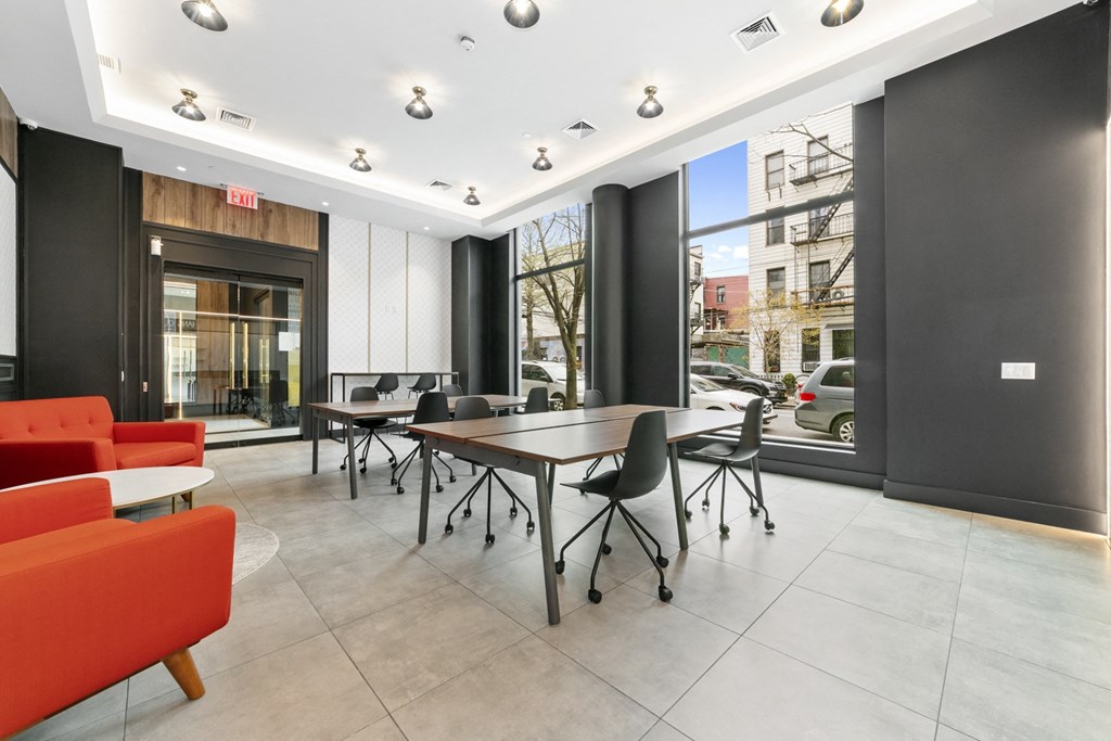 a conference room with a large window and a table and chairs