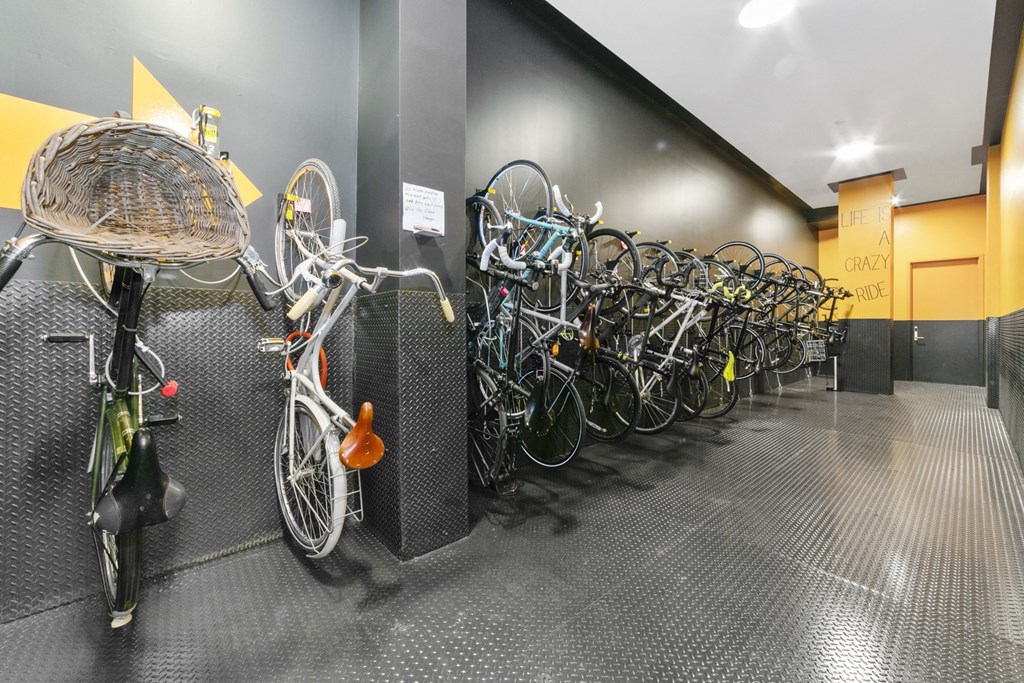 a row of bikes parked in a parking garage