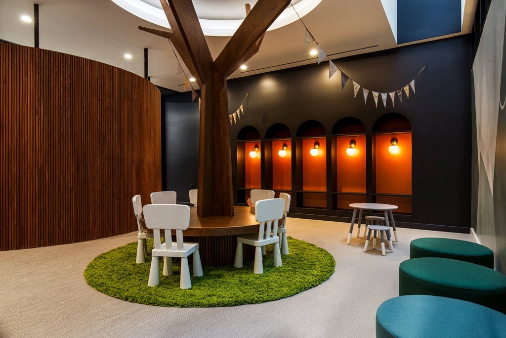 a meeting room with a tree in the middle of it