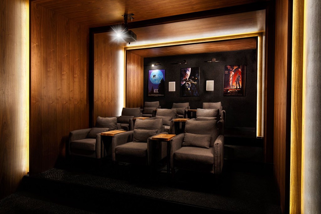 a room with a row of chairs in a dark room