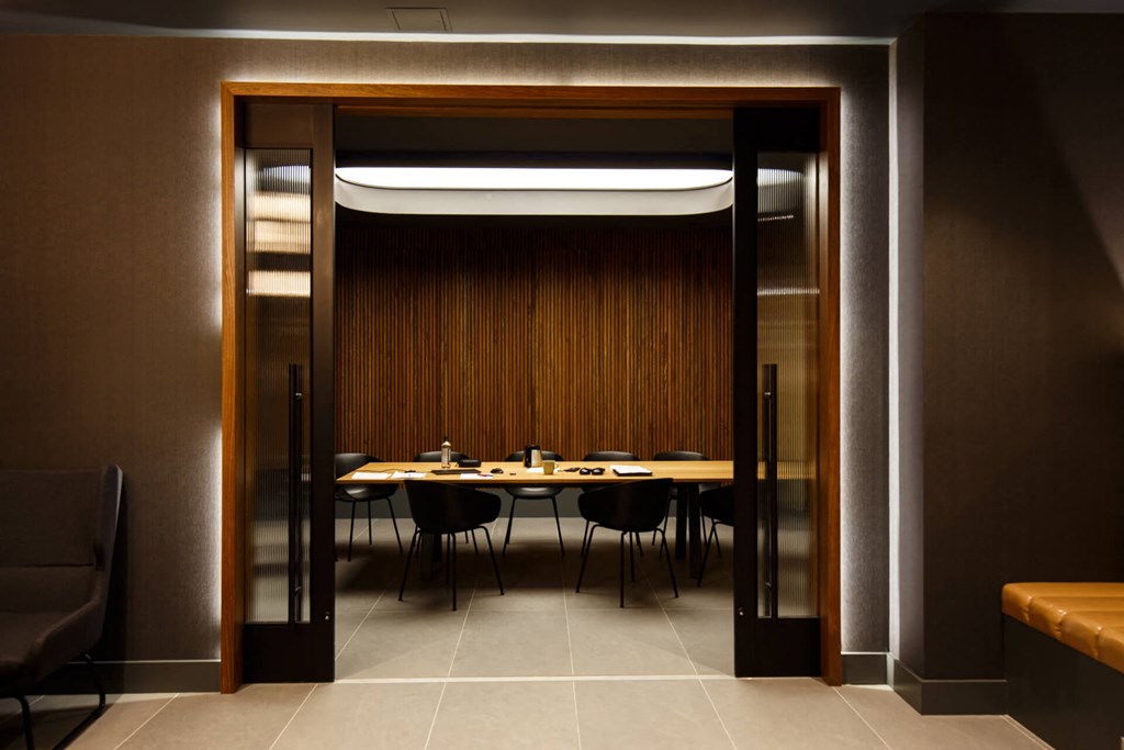 a dining room with a table and chairs