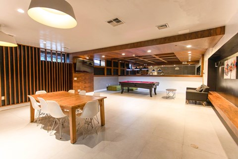 A conference room with a long table and chairs.