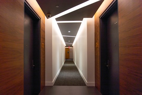 A long hallway with doors on both sides.