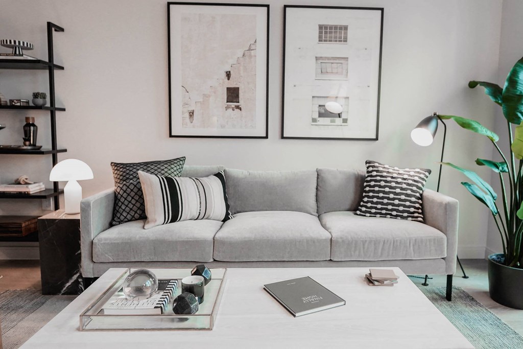 a living room with a couch and a coffee table at The Lively, Jersey City, 07302