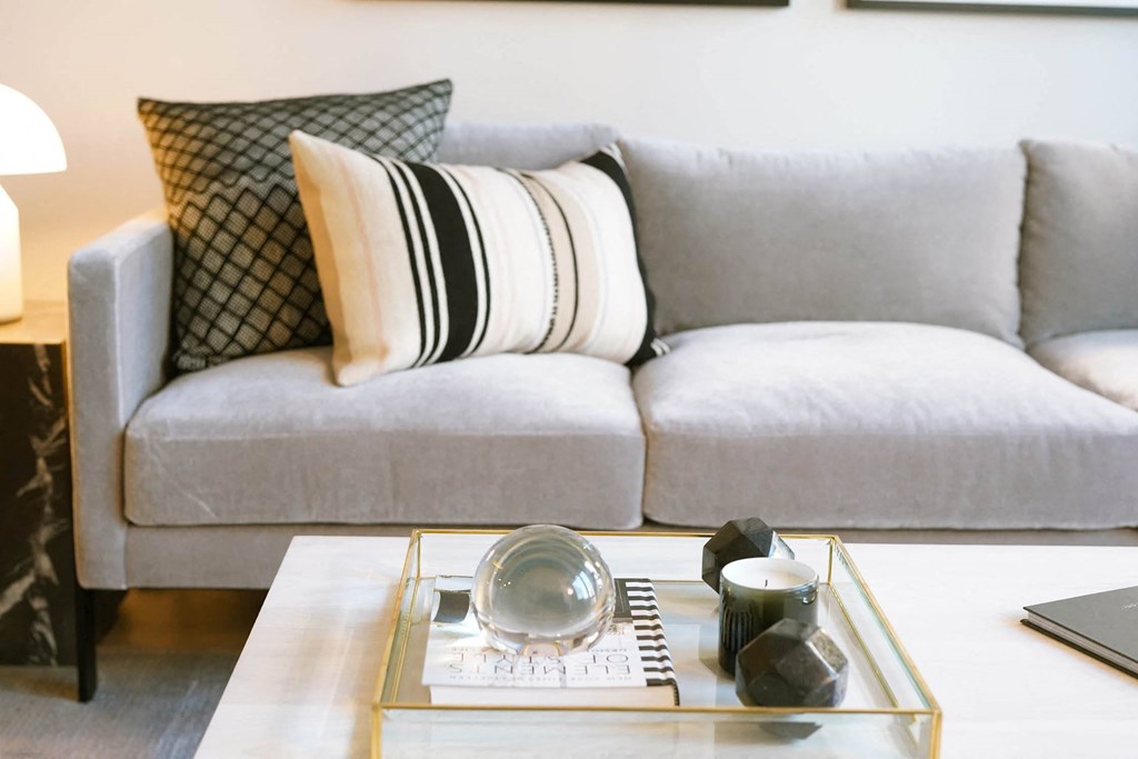 a living room with a couch and a coffee table at The Lively, Jersey City