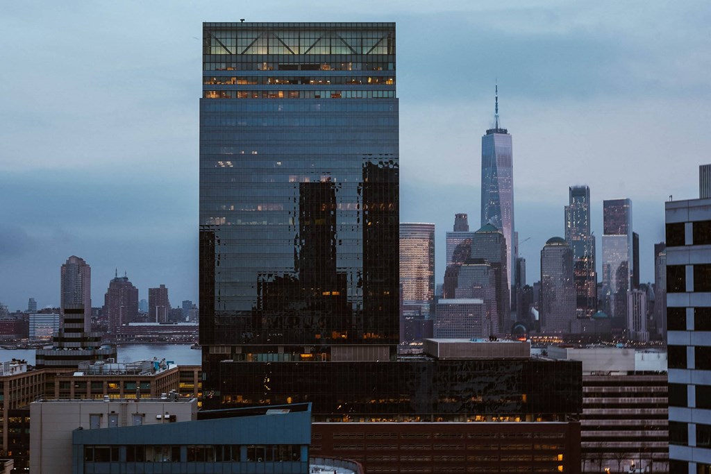 the skyline of the city at dusk at The Lively, Jersey City, NJ 07302