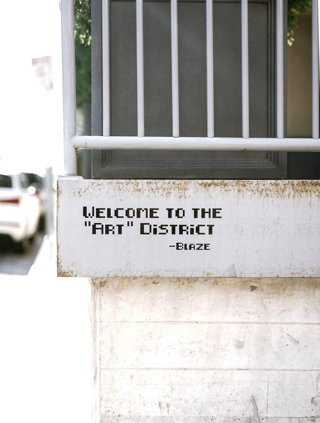 a sign on the side of a building that says welcome to the fifth district gate at The Lively, Jersey City New Jersey