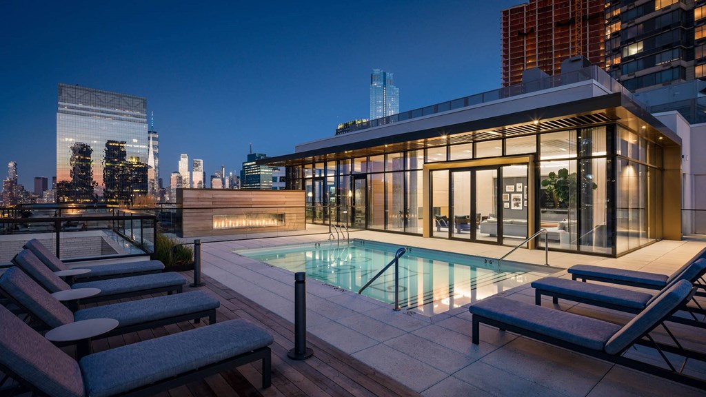 a pool in a room with a blue walled building at The Lively, New Jersey