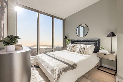 Bright bedroom with waterfront views and modern furnishings at The Paxton Apartments, Brooklyn, New York