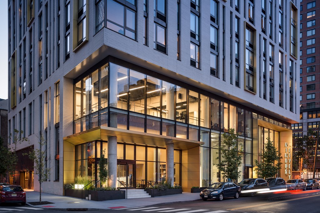 a rendering of a building on a city street at The Lively, Jersey City, 07302