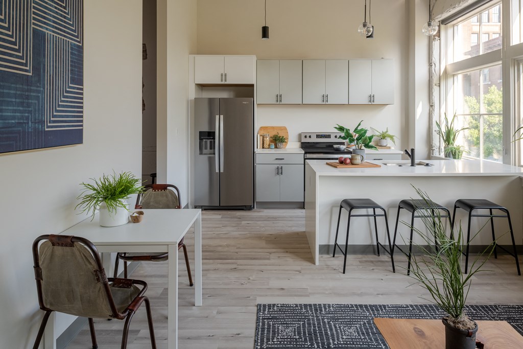 a small apartment with a kitchen and dining area at The 22 Apartments, Missouri, 63103