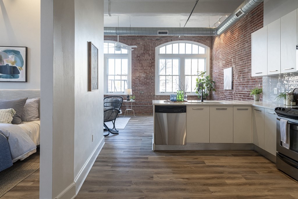 a kitchen and living room in a renovated apartment