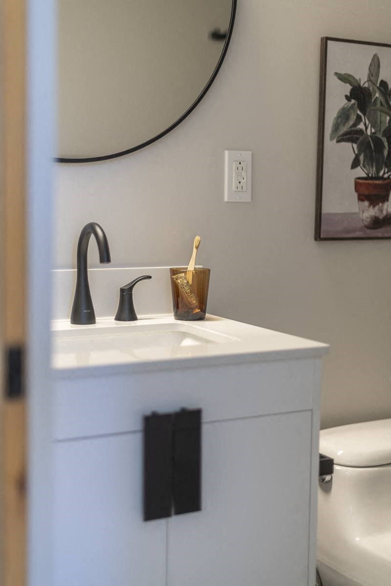 a bathroom with a sink and a mirror