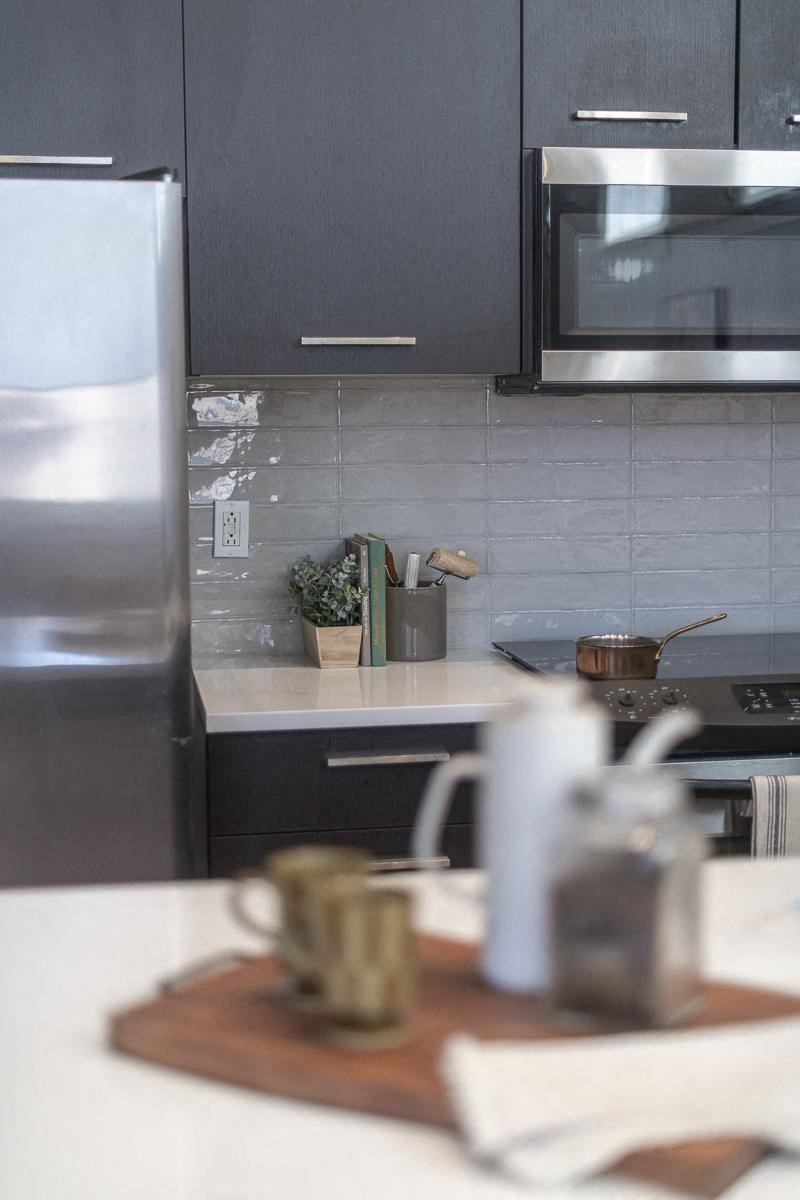 a kitchen with a counter top and a microwave
