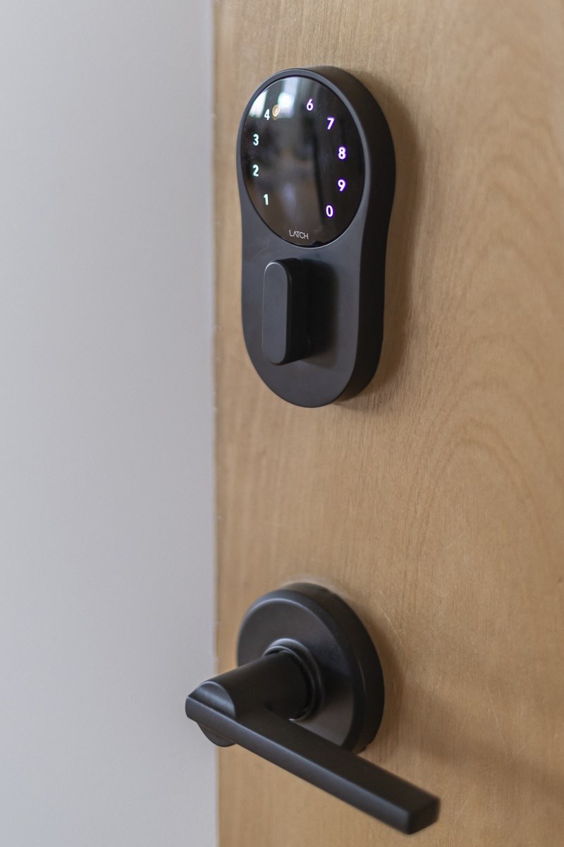 a door with a remote control on the door handle