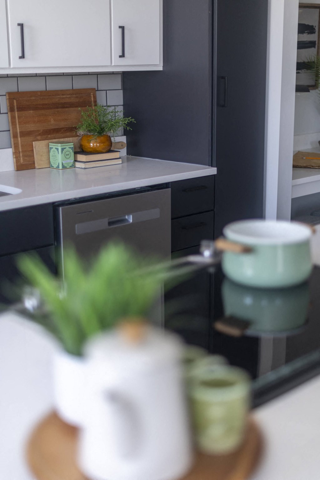 a view of a kitchen with a coffee cup on a table