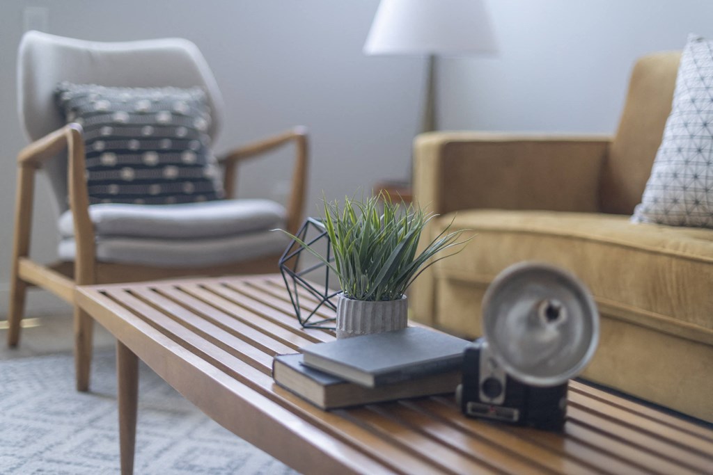a living room with a coffee table and two couches