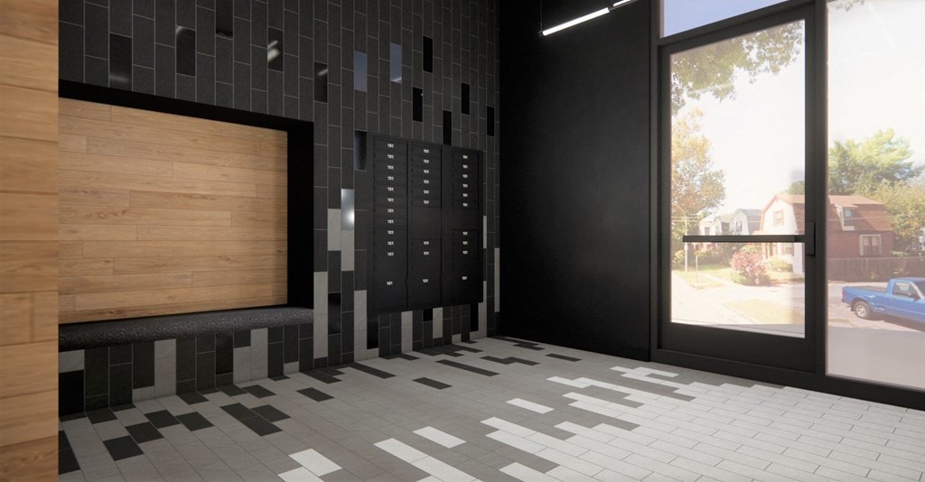 a view of the lobby of a building with black tiles and a wall with a
