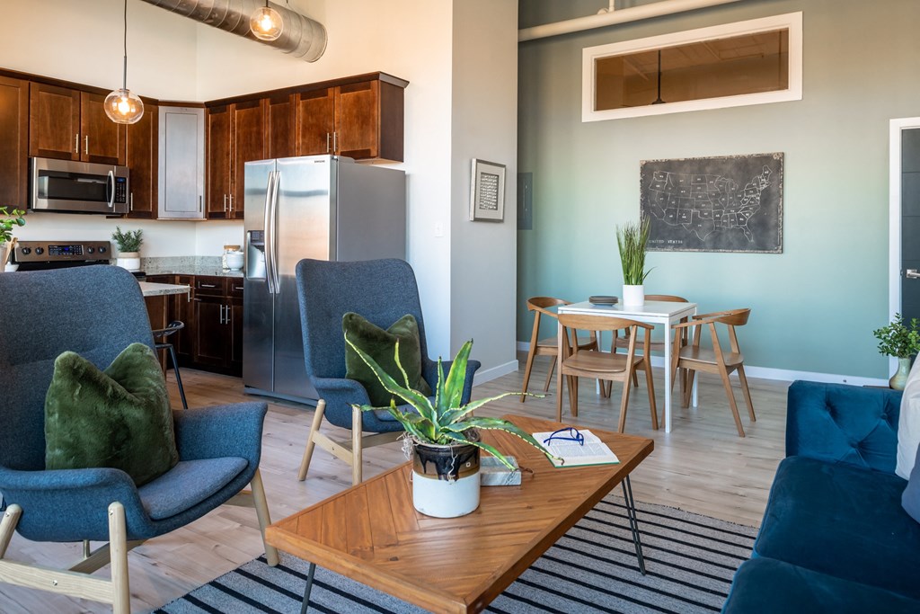 an open concept living room with a kitchen and dining area at The 22 Apartments, St. Louis, MO 63103