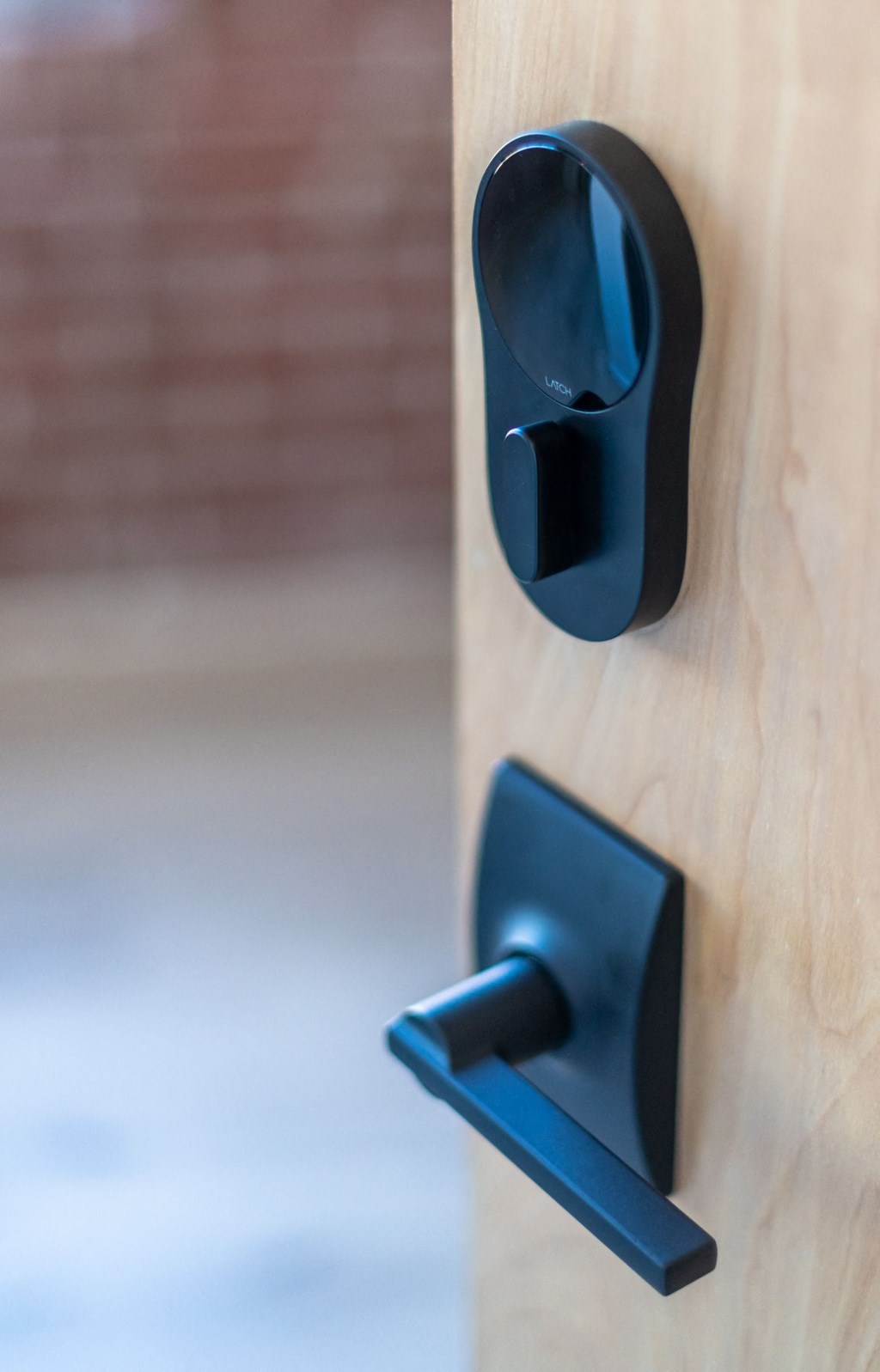 a close up of a door handle and handle on a wooden door at The 22 Apartments, Missouri, 63103